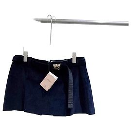 Falda Miu Miu de terciopelo azul marino con botones dorados