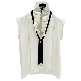 Top Chanel Métiers d'art in seta con volant senza maniche