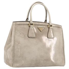 PRADA Bolsa de mão em verniz Bege Tom Dourado