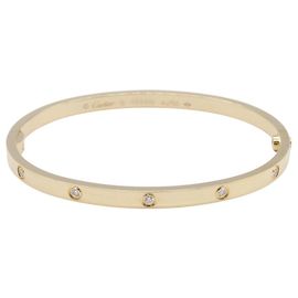 Bracciale con ciondoli Cartier in oro giallo 18K e diamanti