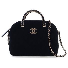 Bolso de mano Coco de terciopelo acolchado negro Chanel con cadena