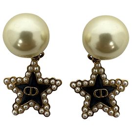 Orecchini Dior Tribales Stella Nera in metallo dorato