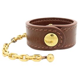 Hermès HERMES Portaguanti Nomad in pelle e metallo Charm Brown