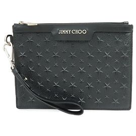 JIMMY CHOO Pochette in pelle con stelle embossed e borchie Wristlet Pouch Black
