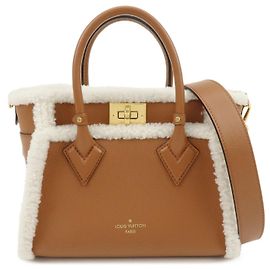 Louis Vuitton Monogram Tuffetage OnMySide PM Shearling 2Way Bag M58918