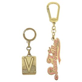 Louis Vuitton Logo Set di 2 ciondoli in metallo per borsa e portachiavi Oro