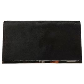 Gucci Clutch de pele preta com placa dourada