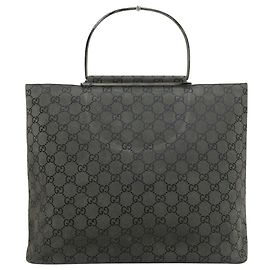 Gucci GG Handtasche mit Metallgriff