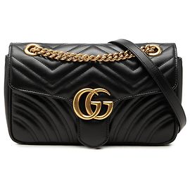 Gucci GG Marmont gesteppte Schultertasche aus Kalbsleder in Schwarz Medium