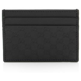 Portacarte signature Gucci in pelle Microguccissima