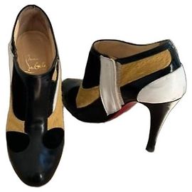 Bottines Christian Louboutin en cuir et poulain