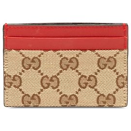 Tarjetero Gucci de lona GG beige