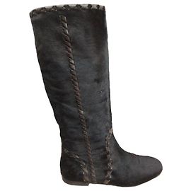 Gucci Botas altas de piel trenzada negra