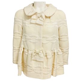 Chaqueta de lana bordada con eslabones de cadena marfil Giambattista Valli con lazo de grosgrain