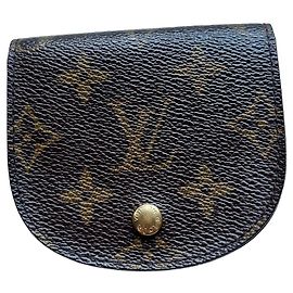 Charming Louis Vuitton "Gousset" model coin purse in Monogram coated canvas.