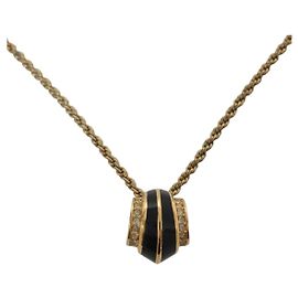 Collana con pendente vintage Christian Dior
Metallo placcato oro, smalto e strass