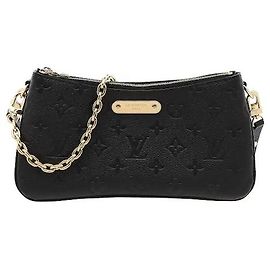 Louis Vuitton Empreinte material, with the Monogram pattern embossed on soft leather, harmonizes with a gold metal plate to complete a sophisticated mood. A double zip closure and central pocket structure make it