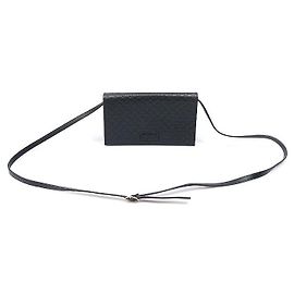 Borsa pochette crossbody in pelle Micro Guccissima con logo GG nero
