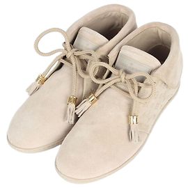 Louis Vuitton Botas de gamuza Monogram en tono dorado
