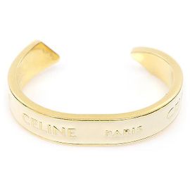 Céline Kleiner Cuff-Armreif mit Gold-Emaille-Schleife in Elfenbein