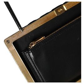 Dolce & Gabbana Clutch da sera in velluto nero con cornice dorata
