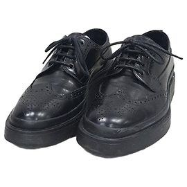 Prada Scarpe Derby Mocassini in pelle spazzolata nera