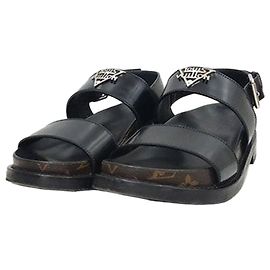 Louis Vuitton Mules basse comfort con logo in metallo