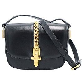 Gucci Mini sac bandoulière en cuir noir et or