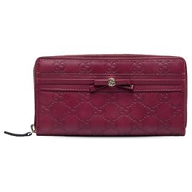 Cartera larga con cremallera Gucci Guccissima Mayfair roja