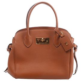 Borsa Louis Vuitton Milla PM Taurillon Marrone M51684