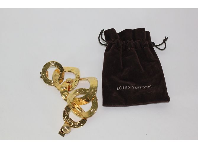 Brazalete Louis Vuitton de metal dorado con grandes anillos - vista 4