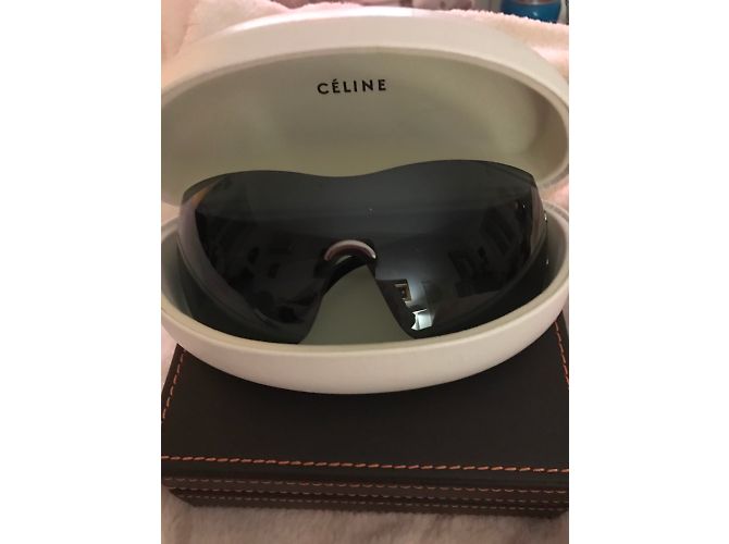 Lunettes de soleil Céline noires en plastique - vue 4