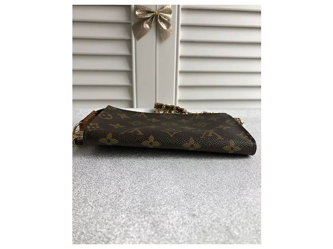 Bucket Louis Vuitton Pochette Marrone - vista 3