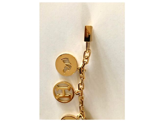 Bolsa Hermès Olga Dourado - vista 9