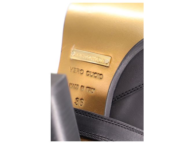 Botas de cano alto Dolce & Gabbana com detalhe de fivela dourada em couro preto - vista 3