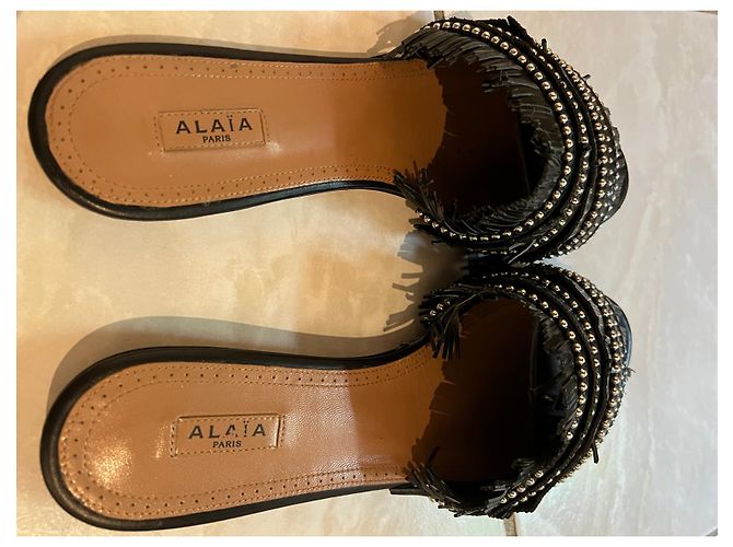 Mules Alaïa con frange in pelle nera Nero - vista 2