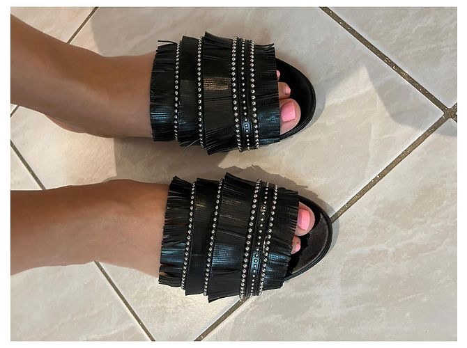 Mules Alaïa con frange in pelle nera Nero - vista 4
