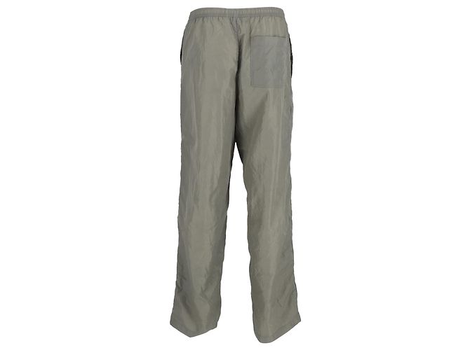 Acne Studios Calças Shell Track com acabamento em veludo e zíper em nylon verde Caqui - vista 3