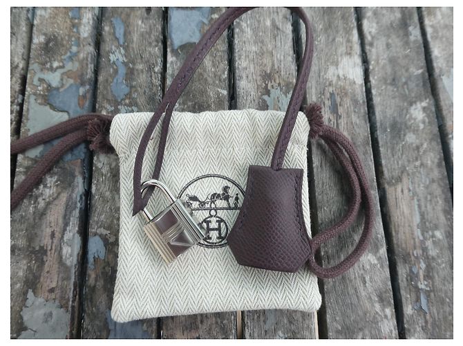 campanella, cerniera e lucchetto hermès nuovo per borsa hermès dustbag Cioccolato - vista 2