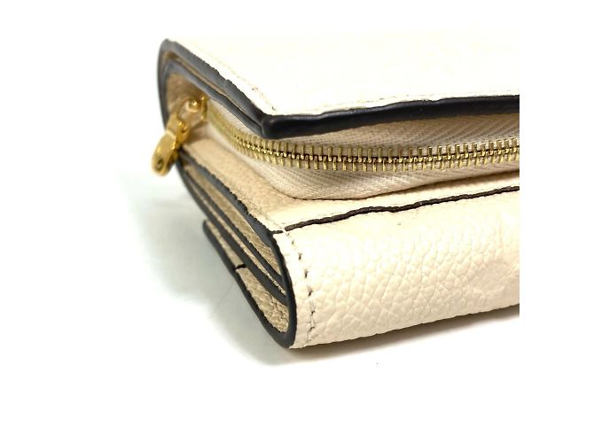 Cartera Metis Trifold Monogram Empreinte Louis Vuitton Beige - vista 5