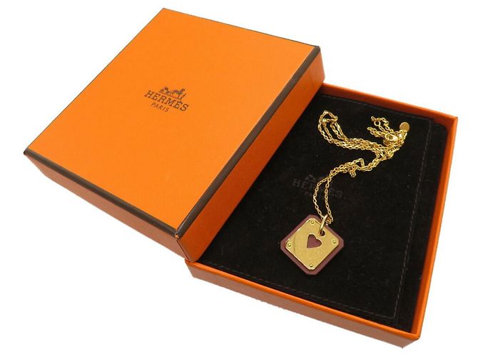 Hermès Collana Hermes As de Coeur PM Cuore Swift Pelle Oro Z stampato D'oro - vista 5