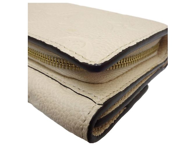 Billetera Trifold Monogram Empreinte Louis Vuitton - vista 4