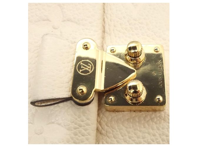 Billetera Trifold Monogram Empreinte Louis Vuitton - vista 5