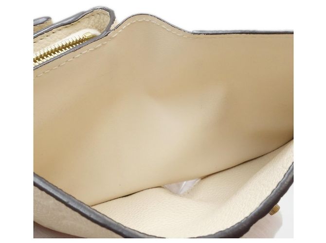 Billetera Trifold Monogram Empreinte Louis Vuitton - vista 7