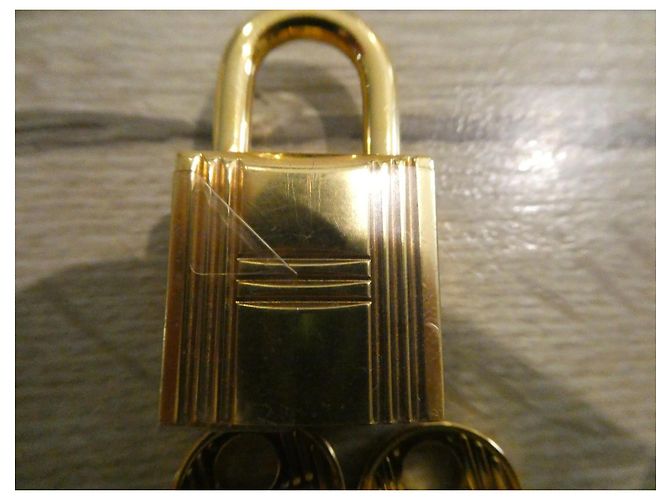 Lucchetto Hermès in acciaio dorato con 2 chiavi per borse Birkin e Kelly Gold hardware - vista 3