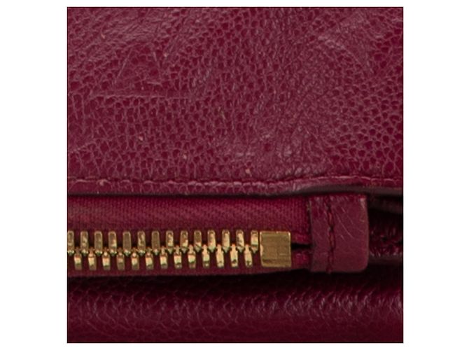 Clutch Petillante in Monogram Empreinte Rosso Louis Vuitton - vista 6