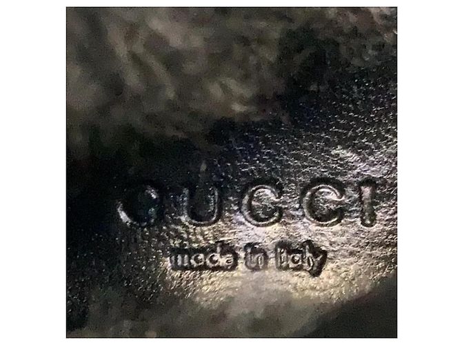 Bottes Gucci en cuir et fourrure noires - vue 4