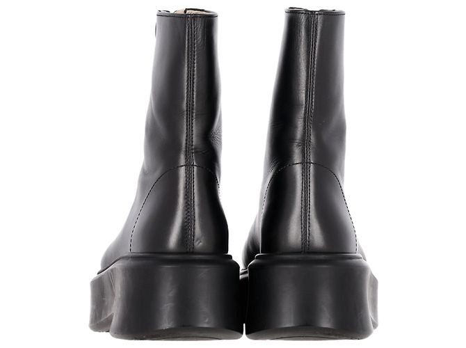 As botas ankle chunky com zíper frontal em couro preto da The Row - vista 5