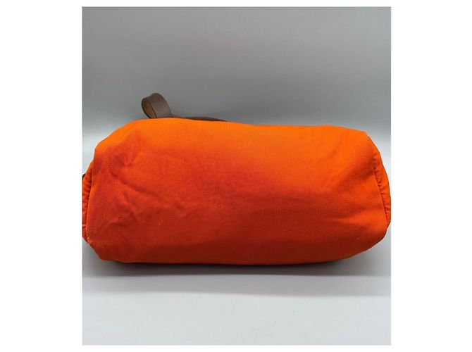 Hermès La sua borsa a spalla in pelle e tela arancione Marrone - vista 12