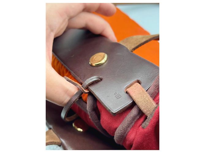 Hermès La sua borsa a spalla in pelle e tela arancione Marrone - vista 17